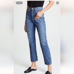 Agolde Pinch Waist High Rise Kick Jeans in Placebo Wash.